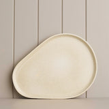 platform sand platter on a wooden shelf