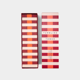 Colorful wooden Tumbling Tower game set with stacked blocks and matching striped box packaging.