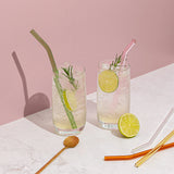 lifestyle shot of smoothies and straws on table