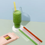 lifestyle shot of straws and smoothie next to them