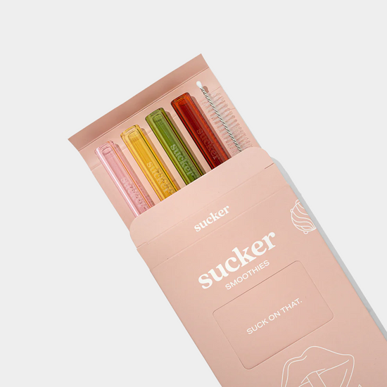 multi-coloured glass smoothie in packaging opened up on white background