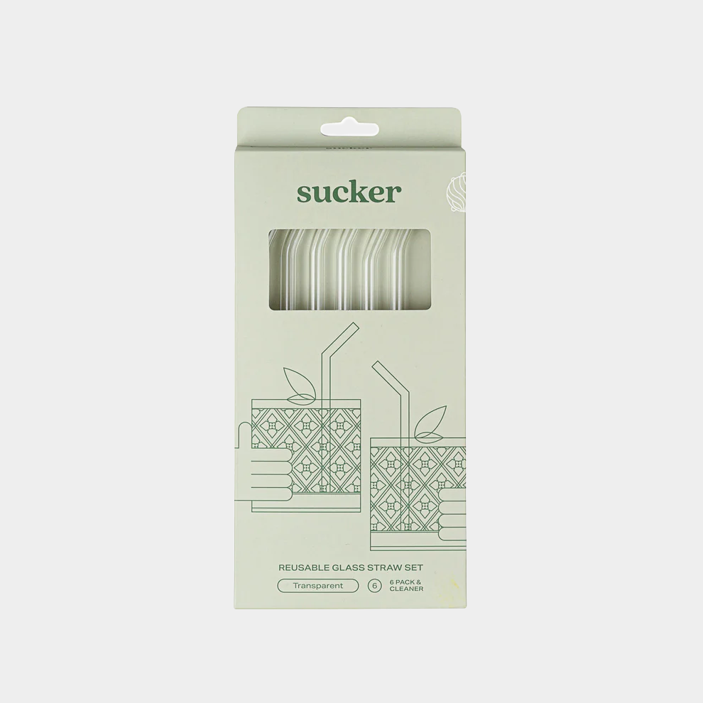 clear glass drinking straws in packaging on white background