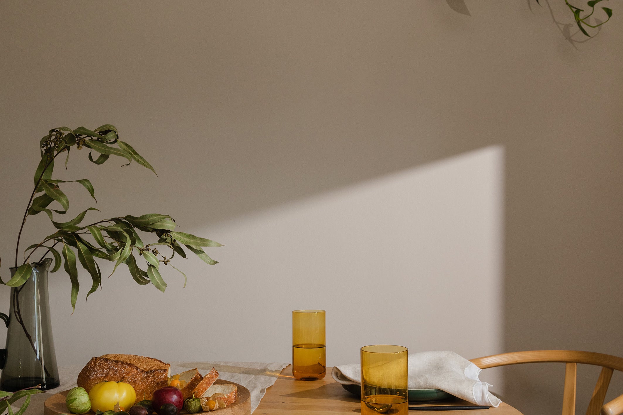 table set with food and napkins with sun shining through 