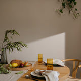 table set with food and napkins with sun shining through 