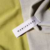 up close picture of a pistachio green and white beach towel