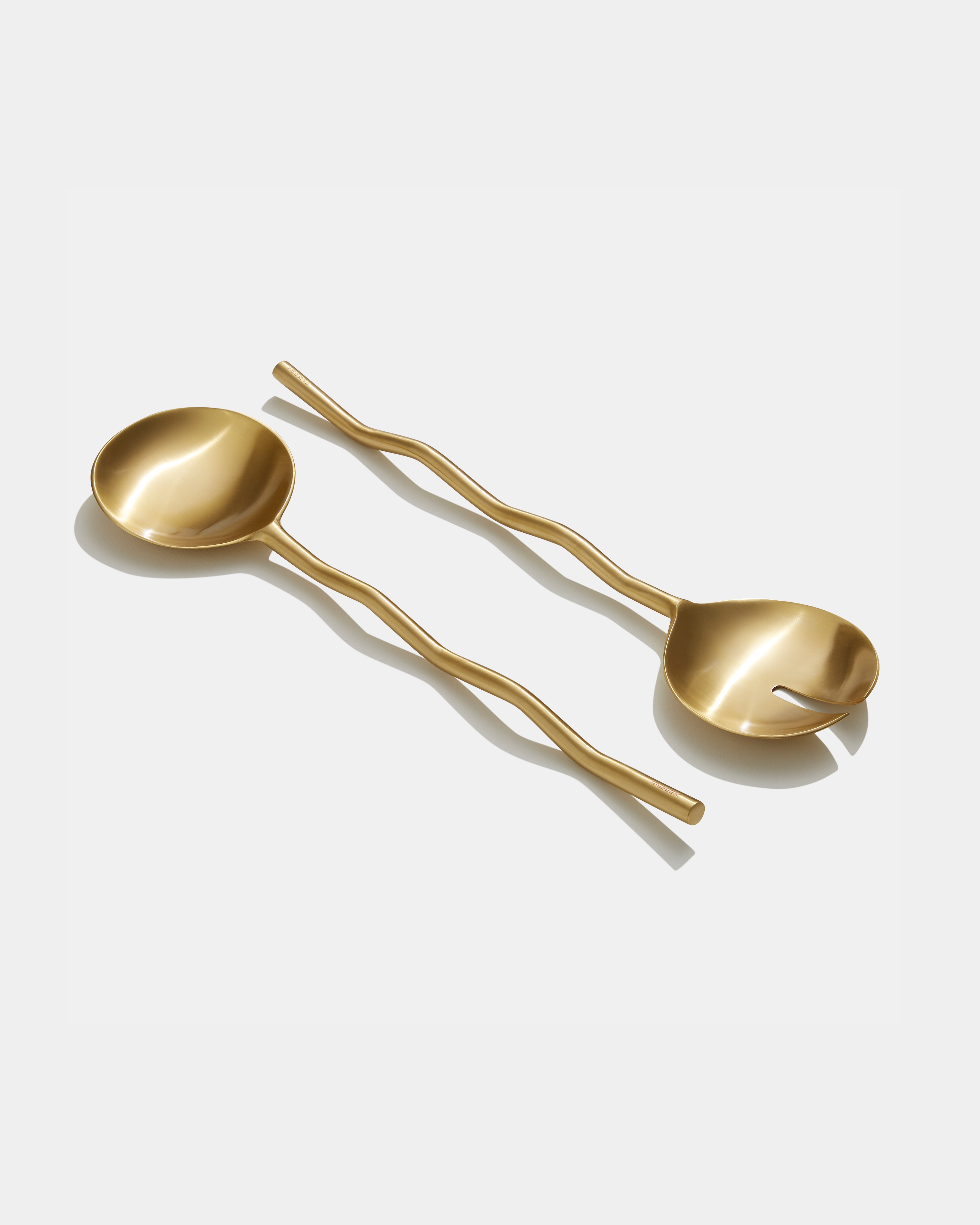 wave salad servers on white background