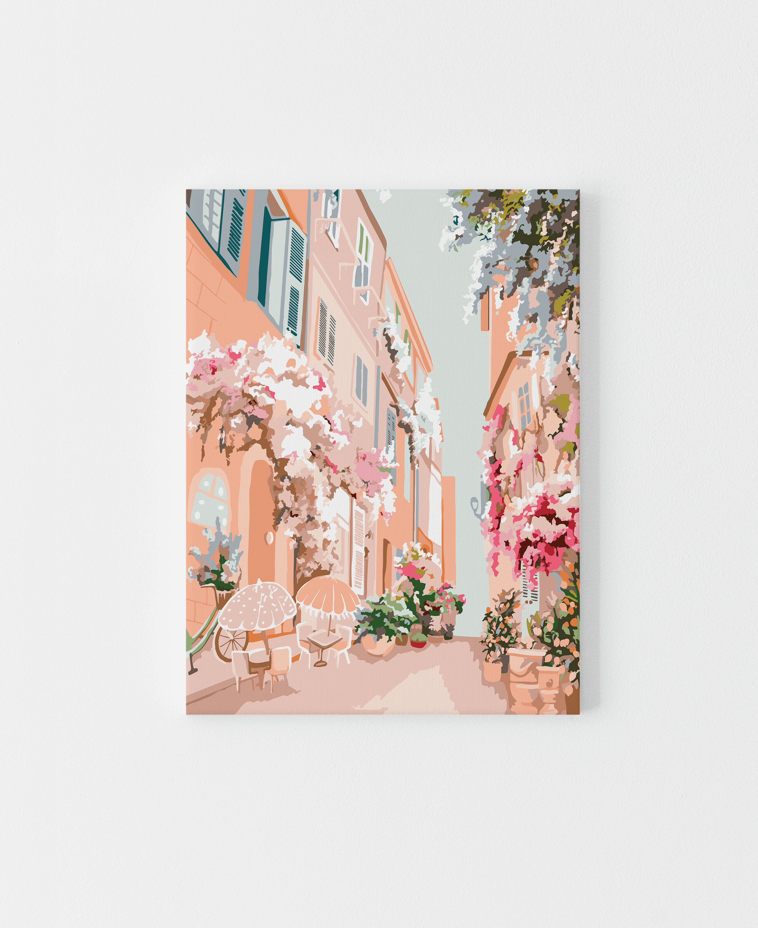 Paint by numbers kit featuring a pastel floral French street scene with buildings and outdoor seating.