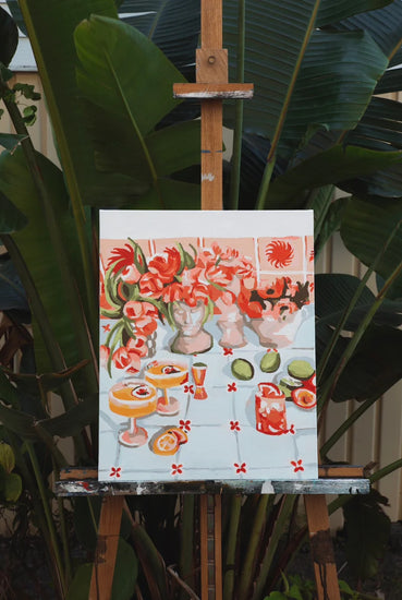 artwork of cocktail table sitting on easel 