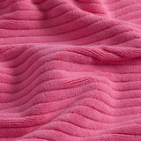 up close picture of texture of pink bath mat