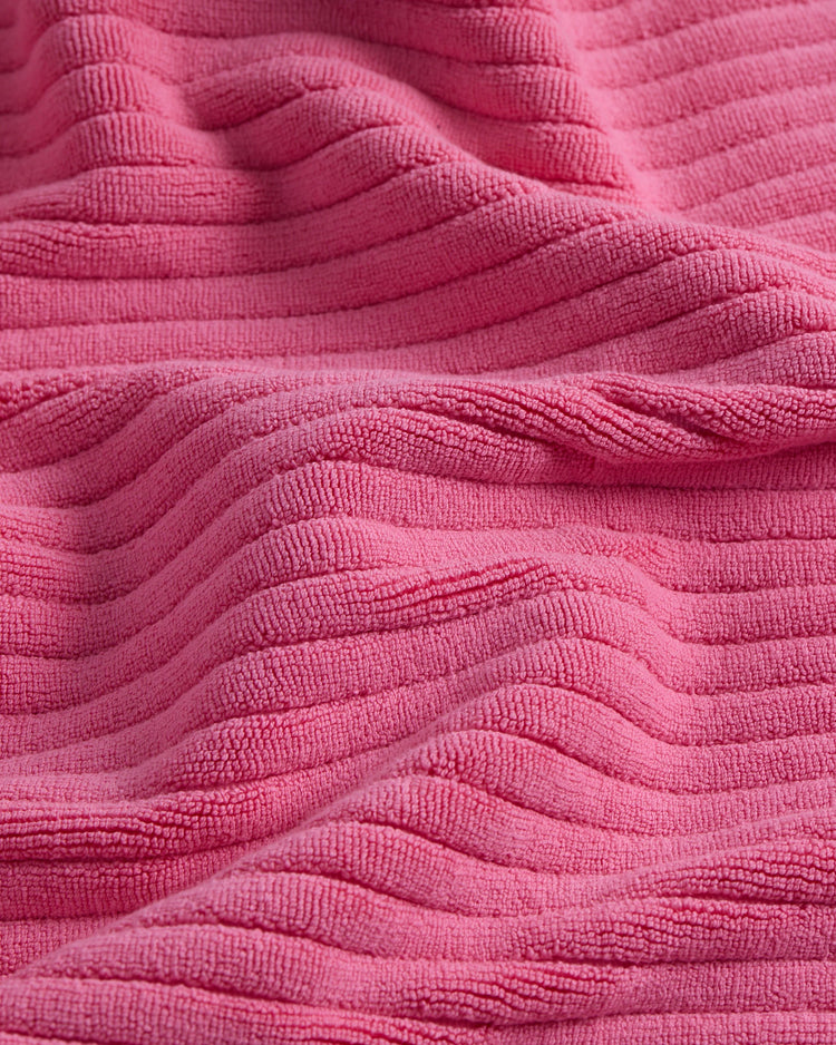 up close picture of texture of pink bath mat