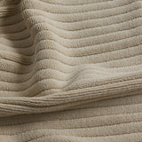 up close picture of texture of beige bath mat