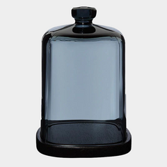 glass candle dome sitting on white background