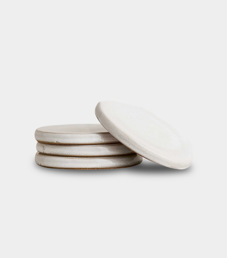 white coasters sitting on white background