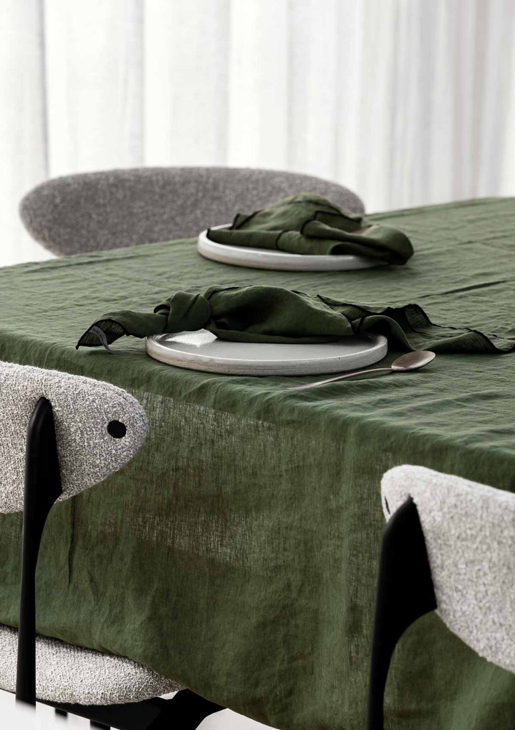 forest green tablecloth with forest green napkins on it 