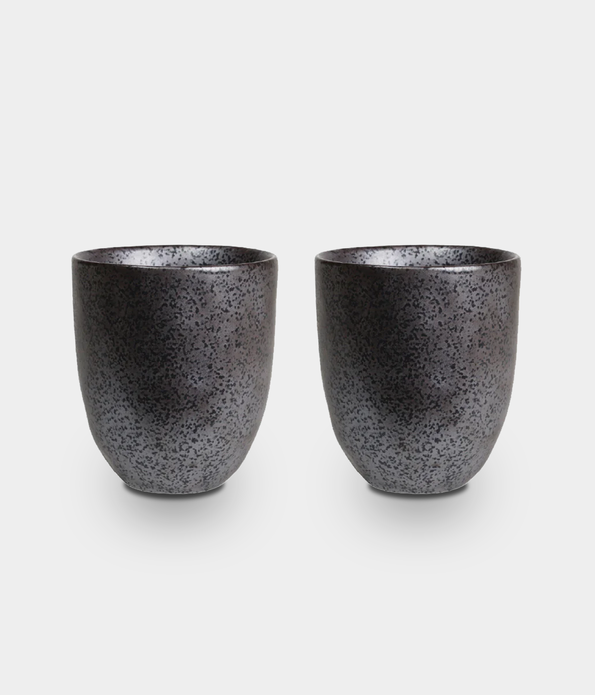 black mugs sitting on a white background