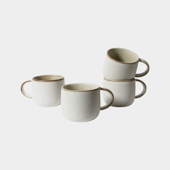 4 grey mugs sitting on white background