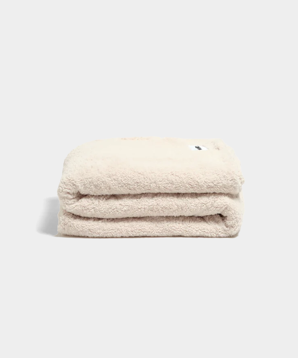 white fluffy throw blanket sitting on white background