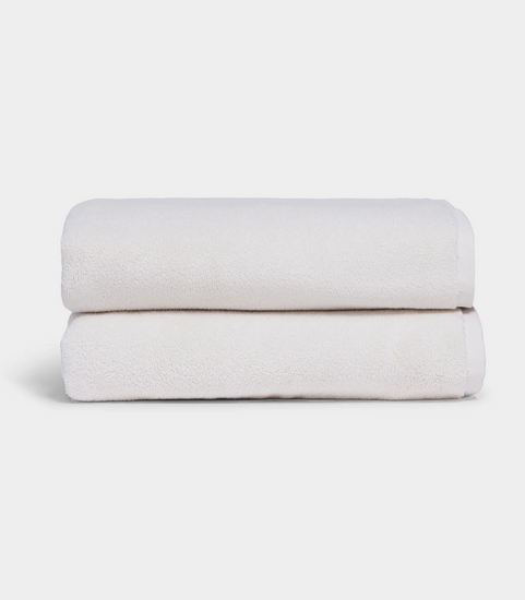 white towel sitting in stack on white background