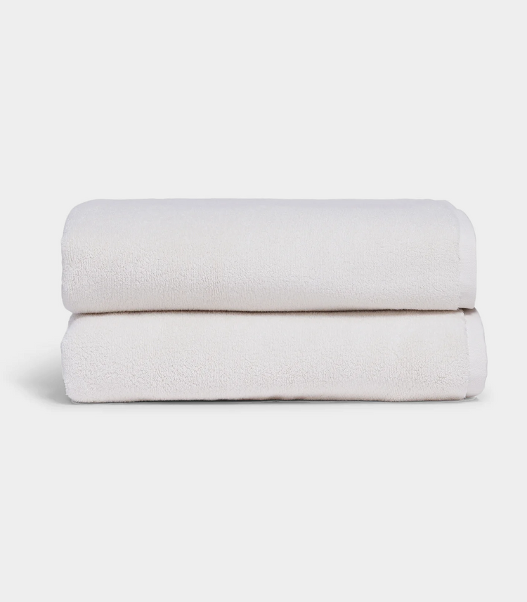 white towel sitting in stack on white background