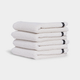 white face washer towel on white background