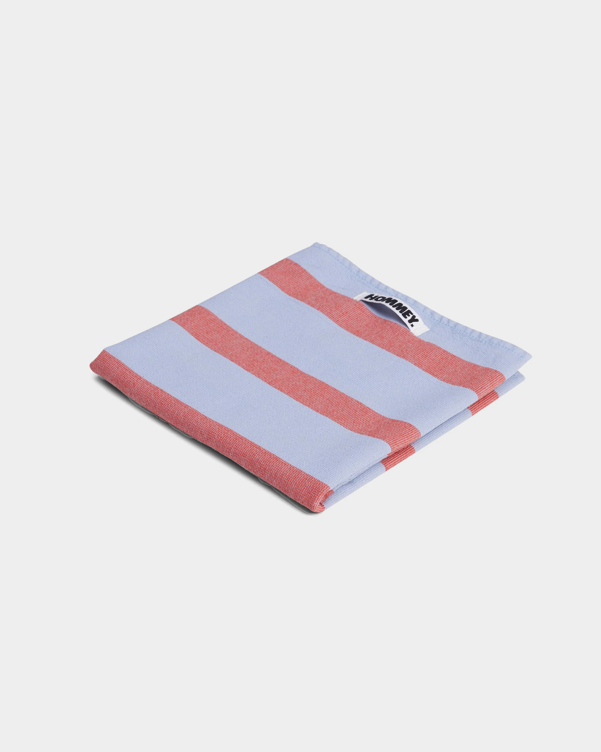 striped red and blue tea towel on white background