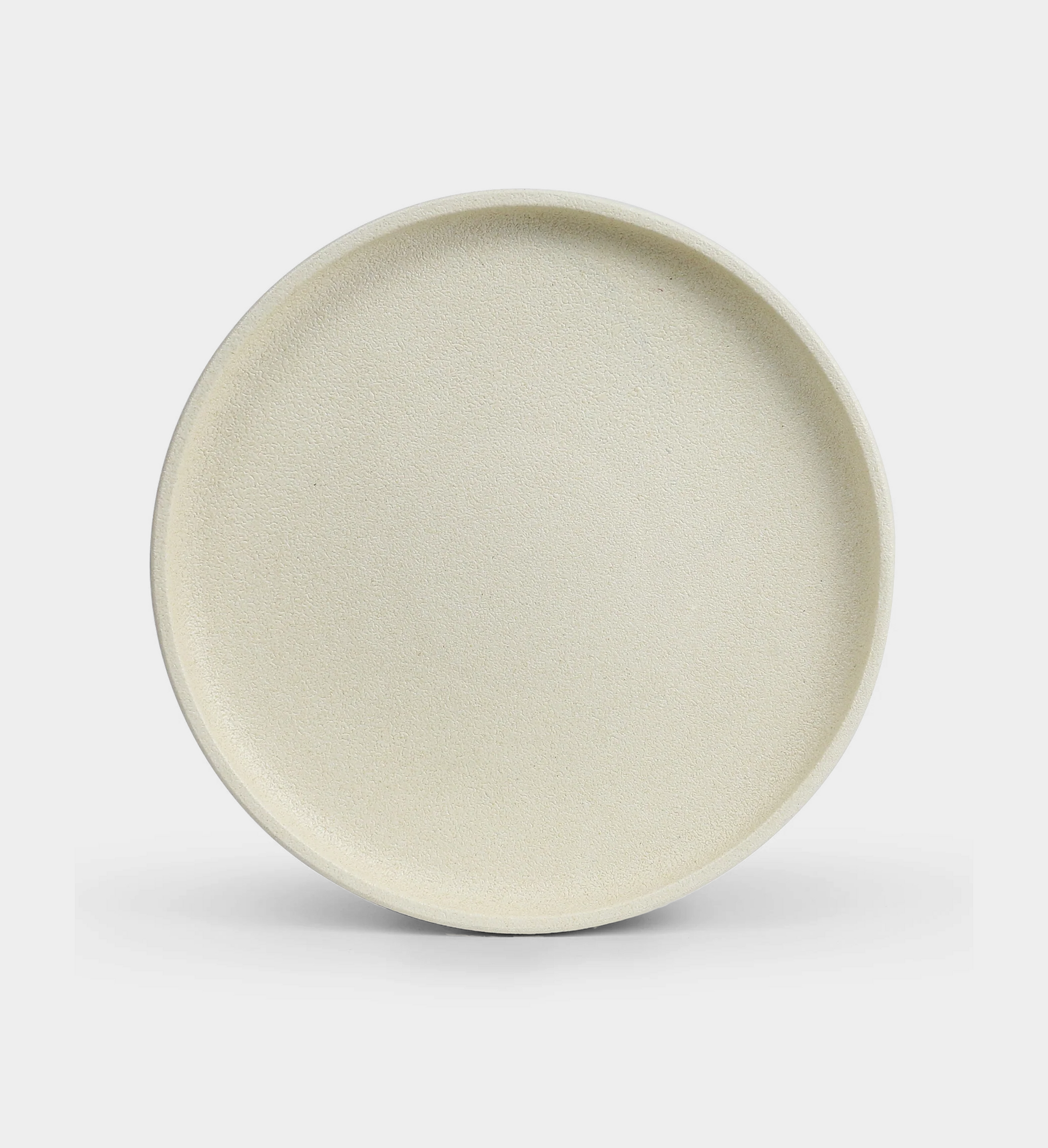 sand platform dinner plate sitting on a white background