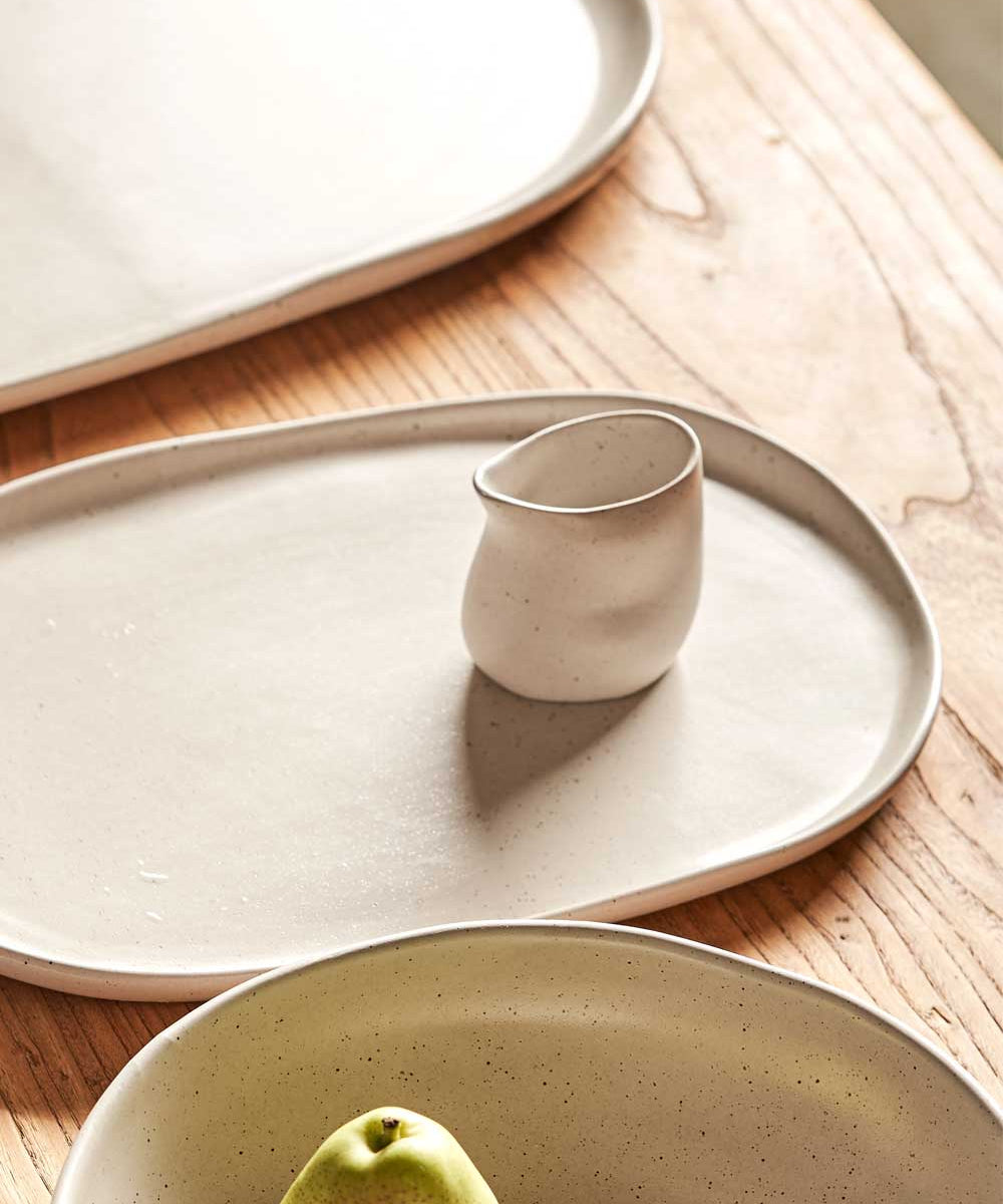 small white pouring jug on table 