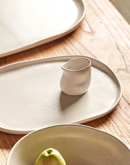 small white pouring jug on table 