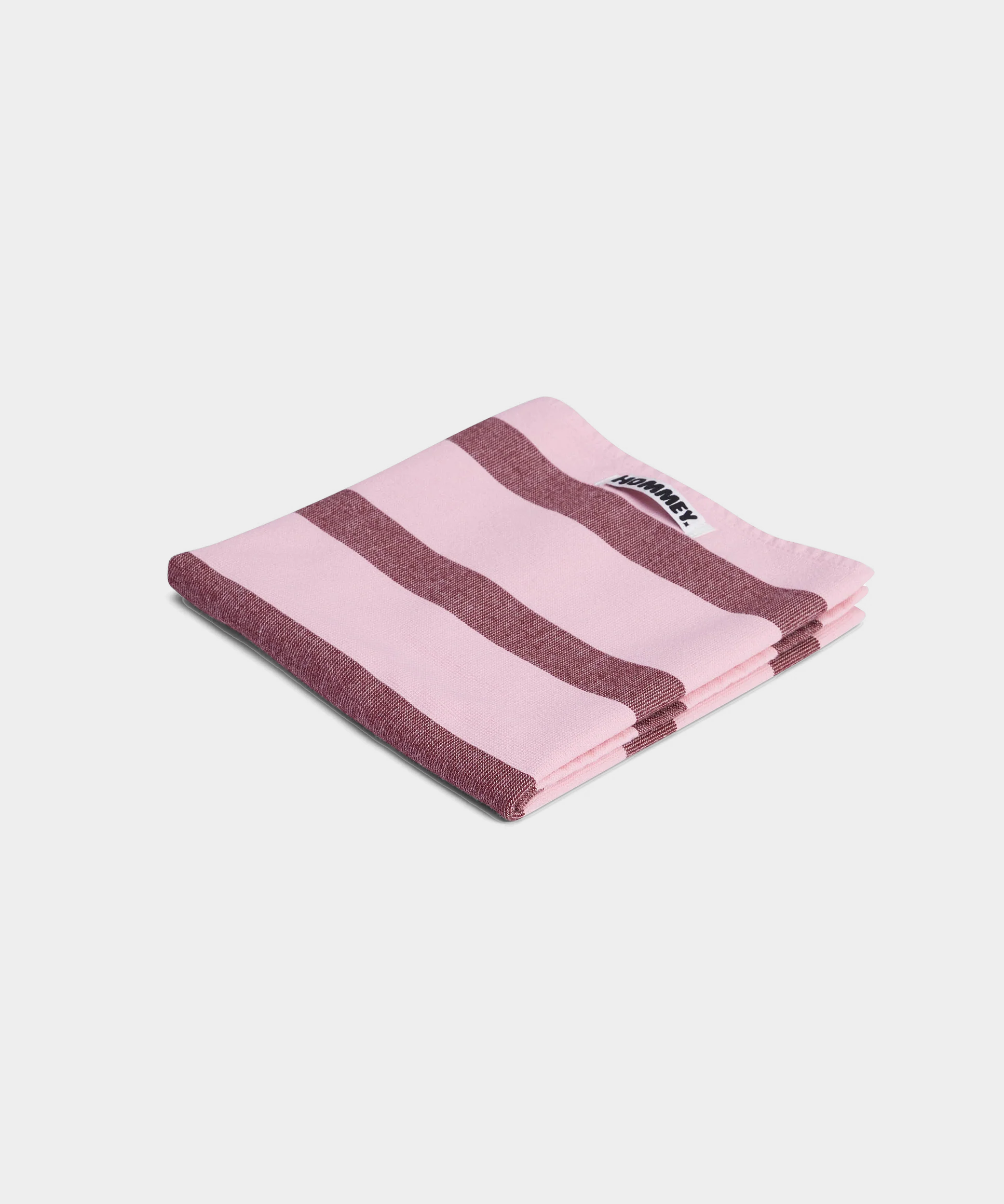 striped pink and red tea towel on white background 