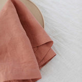 up close image of a rose pink napkin folded