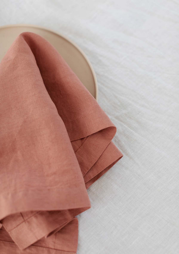 up close image of a rose pink napkin folded