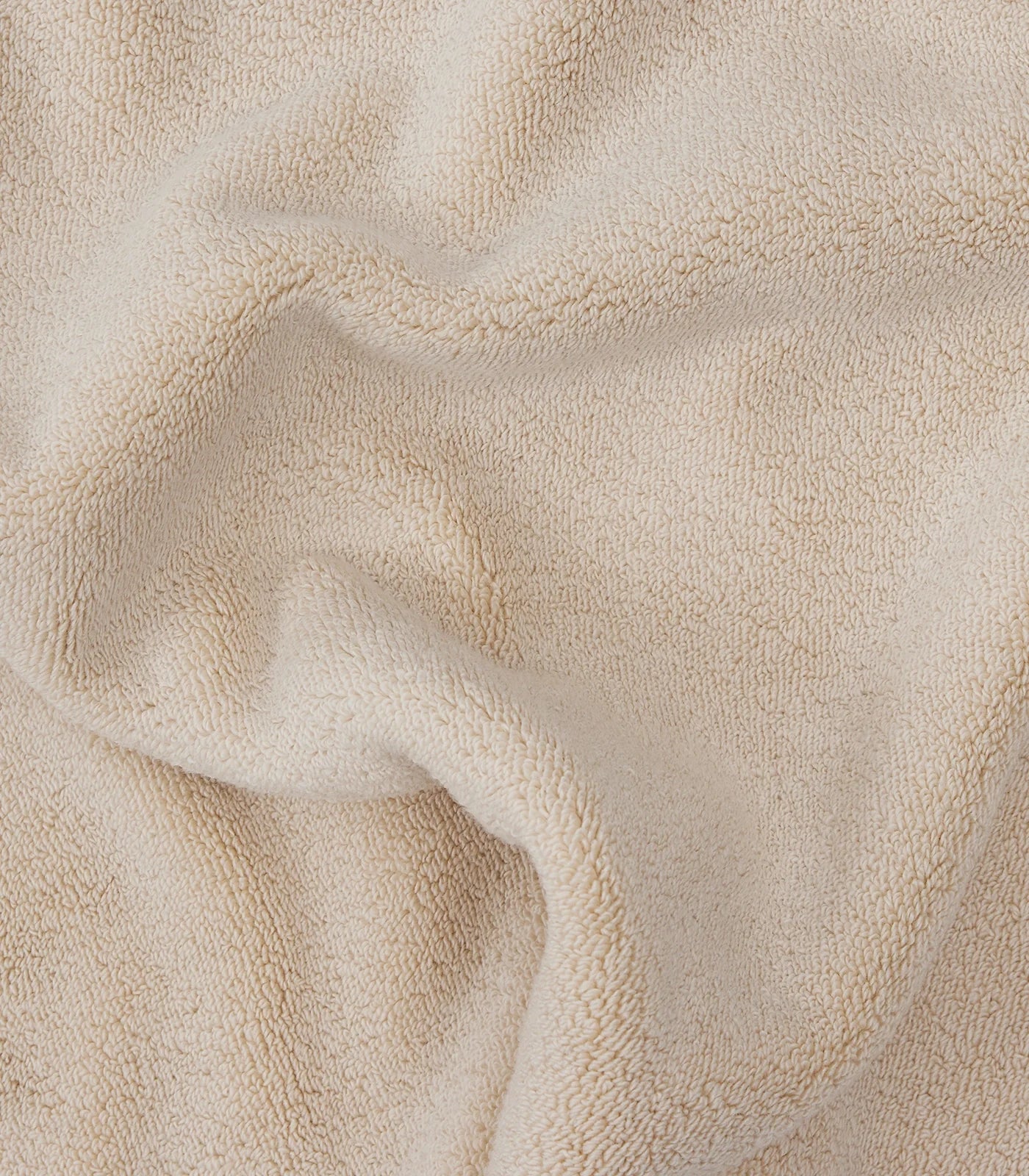 beige face washer towel picture up close