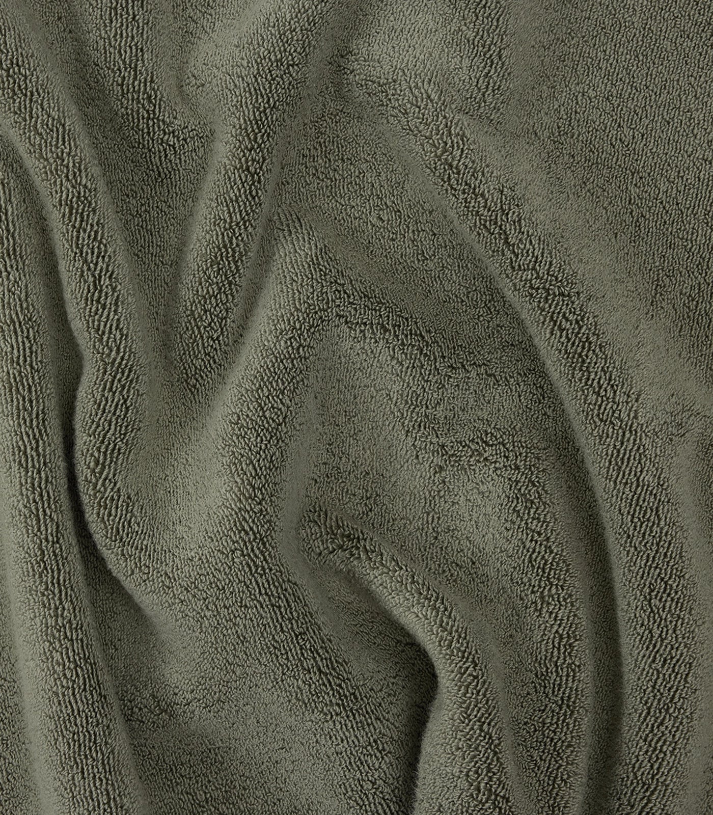 up close picture of dark green towel texture