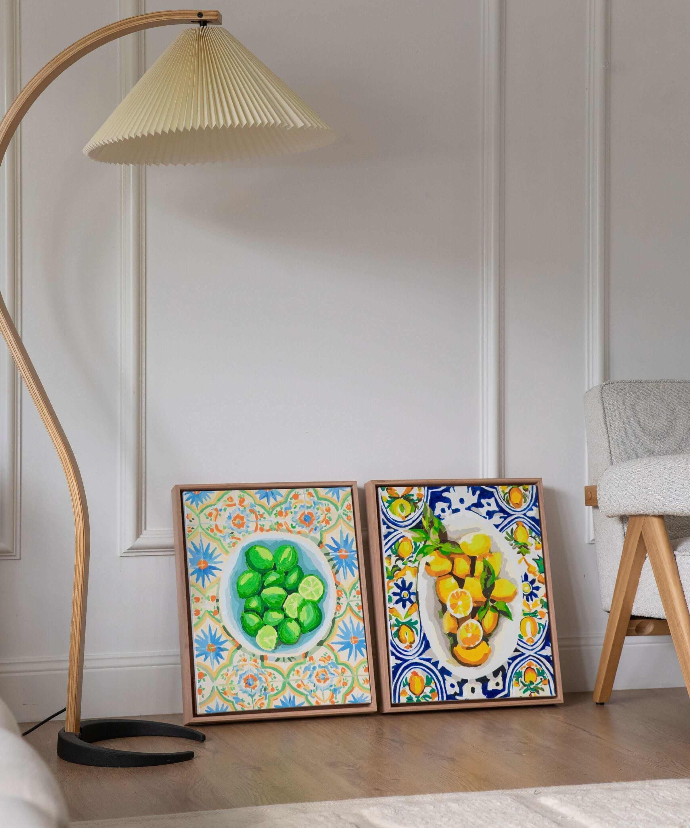 wall art of a bowl of lemons and a bowl of limes sitting side by side against a wall