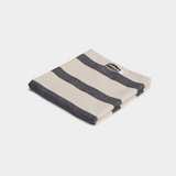 striped white and black tea towel on white background
